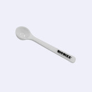 Biobizz white measuring spoon designed for precise dosage of organic microbiome booster.